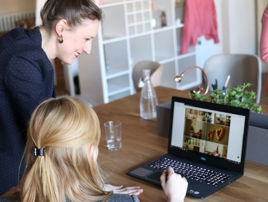 girl using black laptop computer