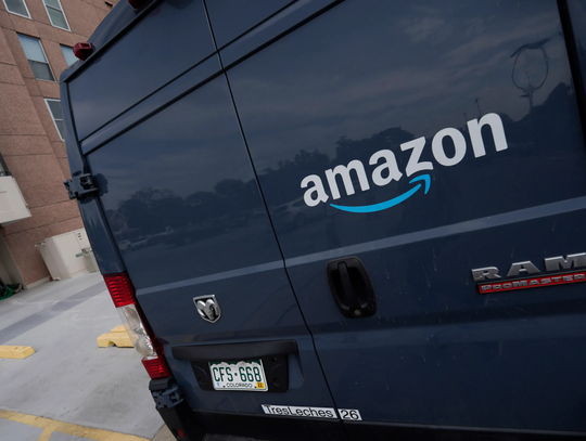 Amazon suffers rare quarterly loss as online shopping slows