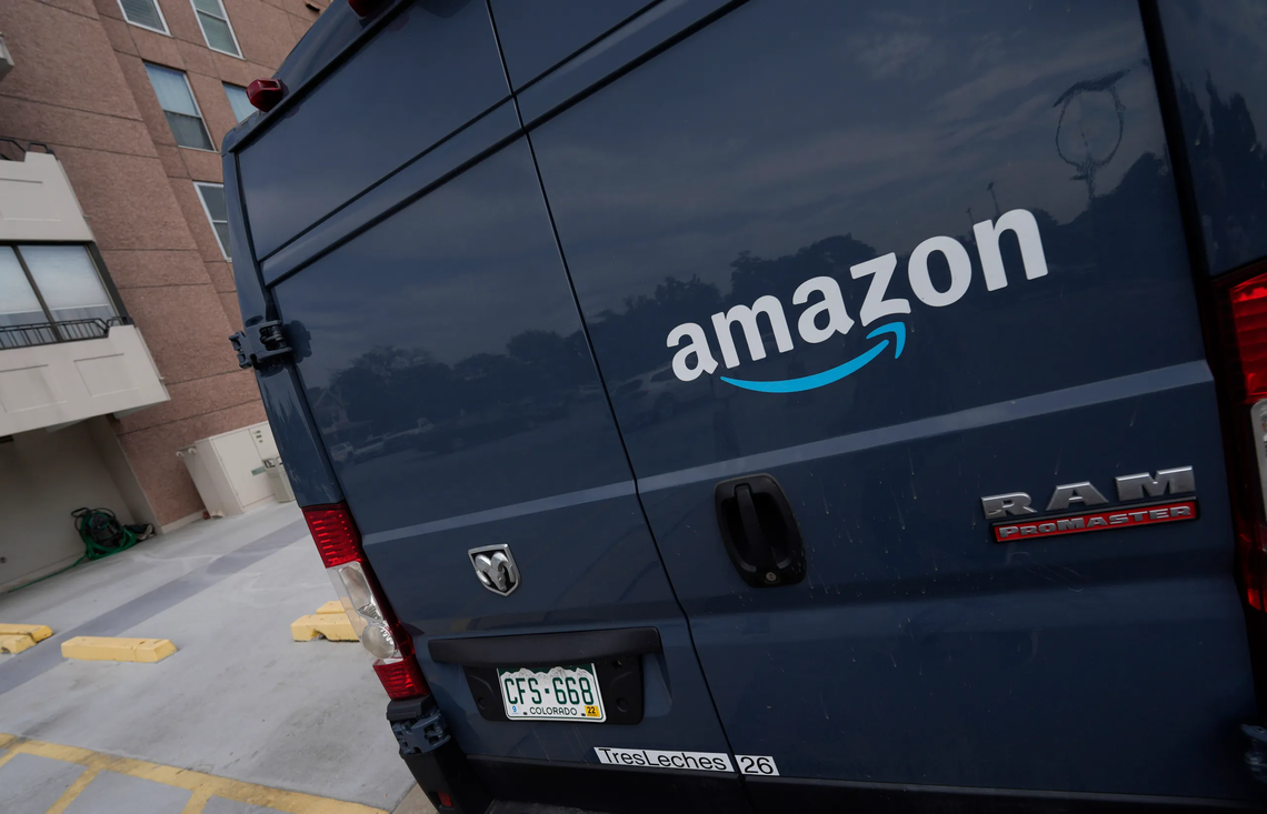 Amazon suffers rare quarterly loss as online shopping slows